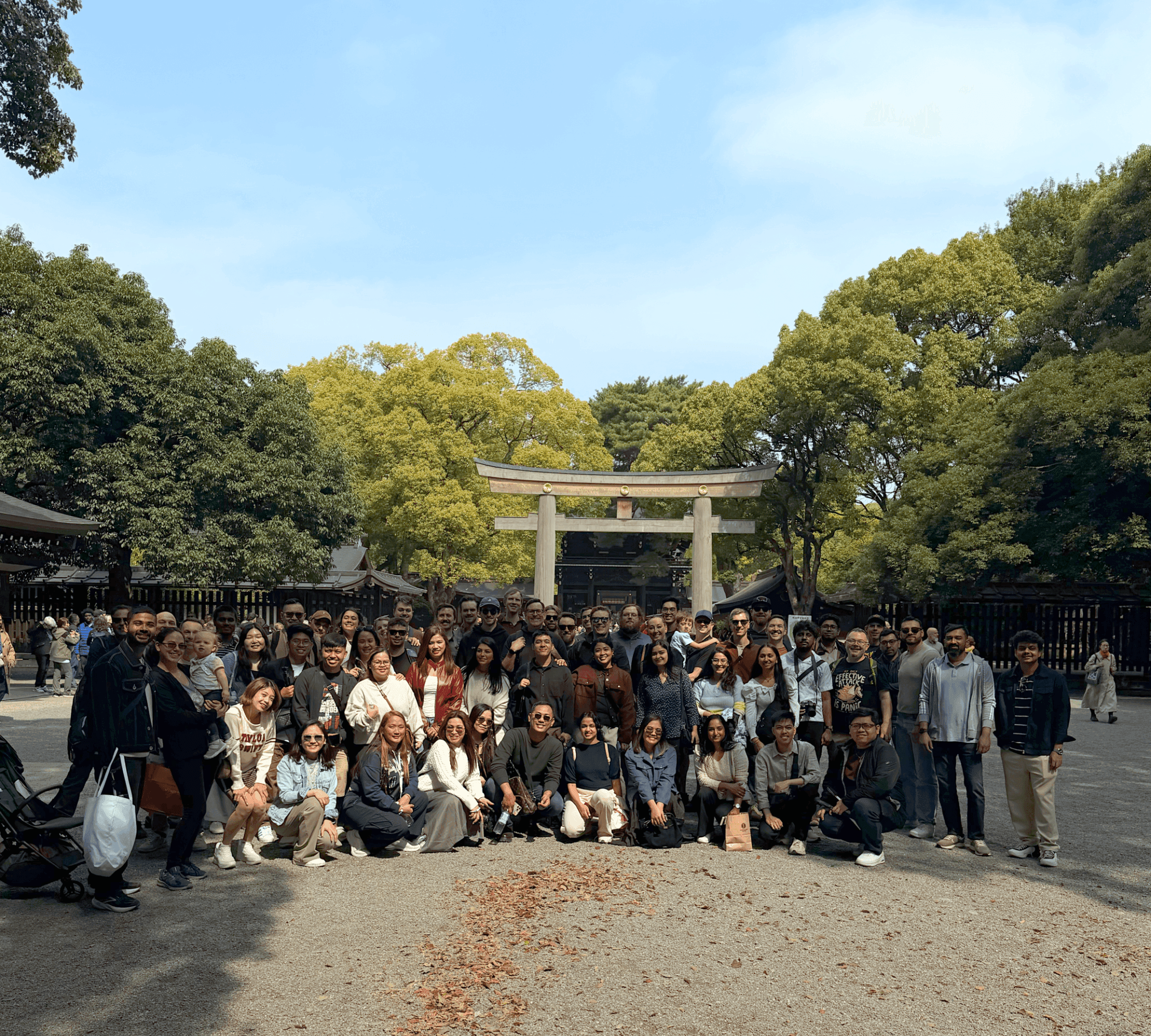 Team at a Japanese temple gate