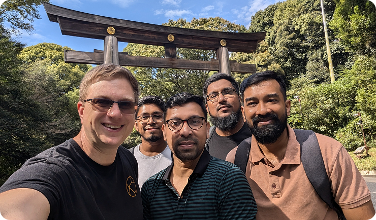 Team selfie at torii gate