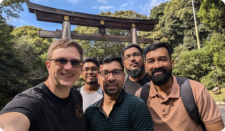 Team selfie at torii gate